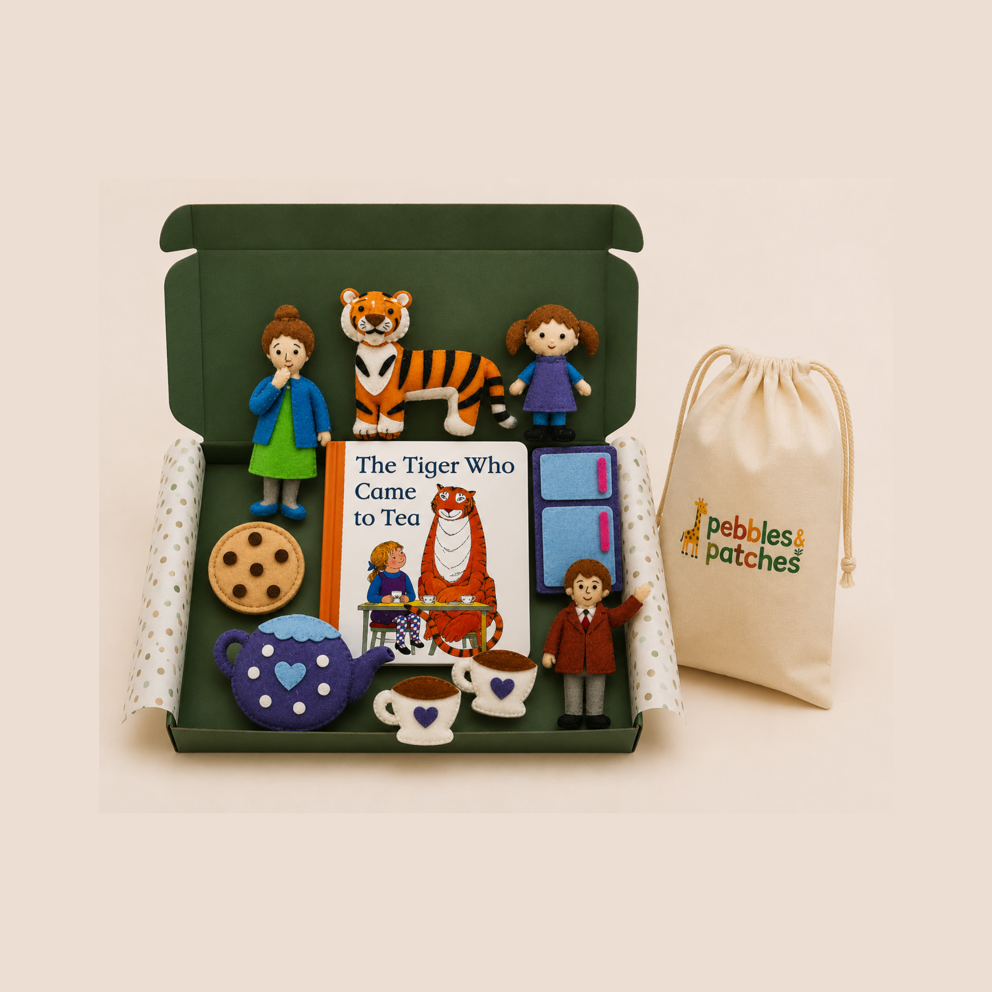 Set of figurines from 'The Tiger Who Came to Tea' story box with a book and a drawstring bag on a beige background