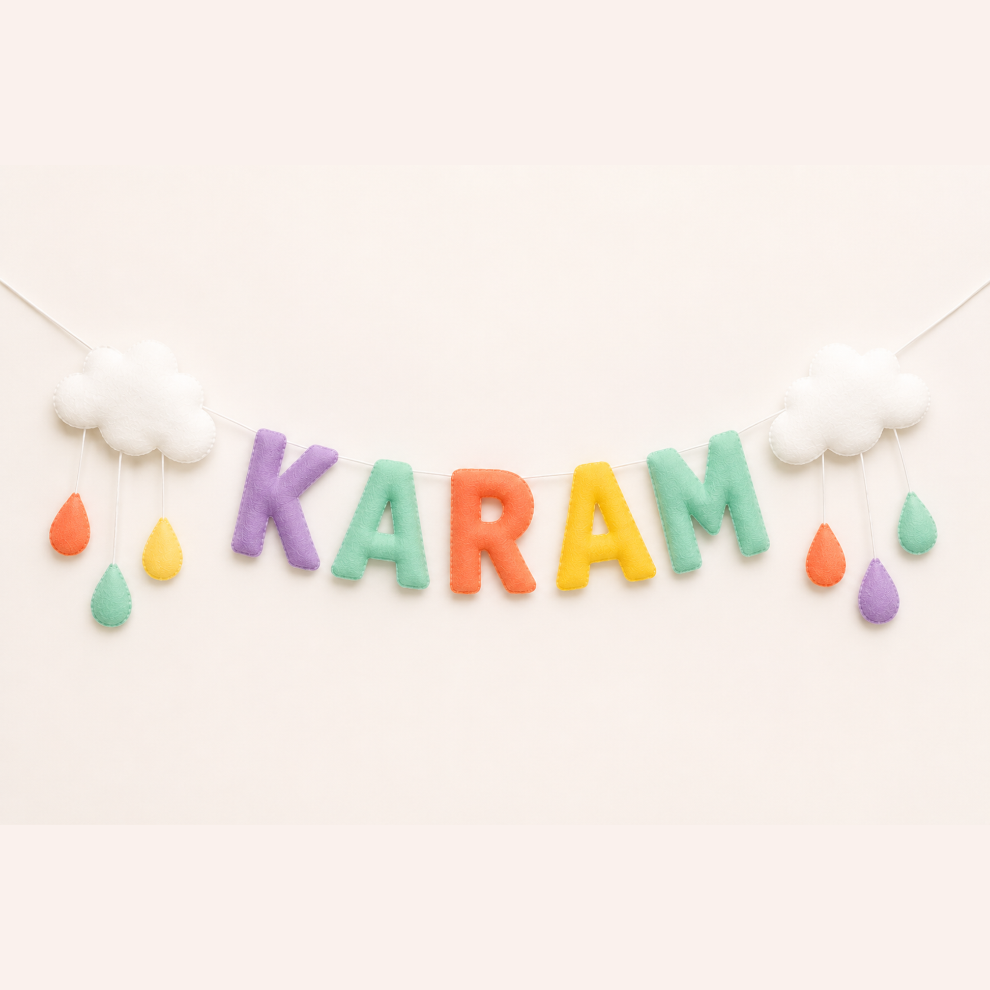 Colorful 'Karam' banner with raindrop name garland on a white background