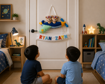 Two children sitting on the floor in a bedroom looking at a door with teddy bears and colorful letters.