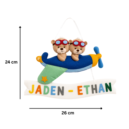 Plush airplane with teddy bears and a nameplate labeled 'Jaden Ethan' on a white background.