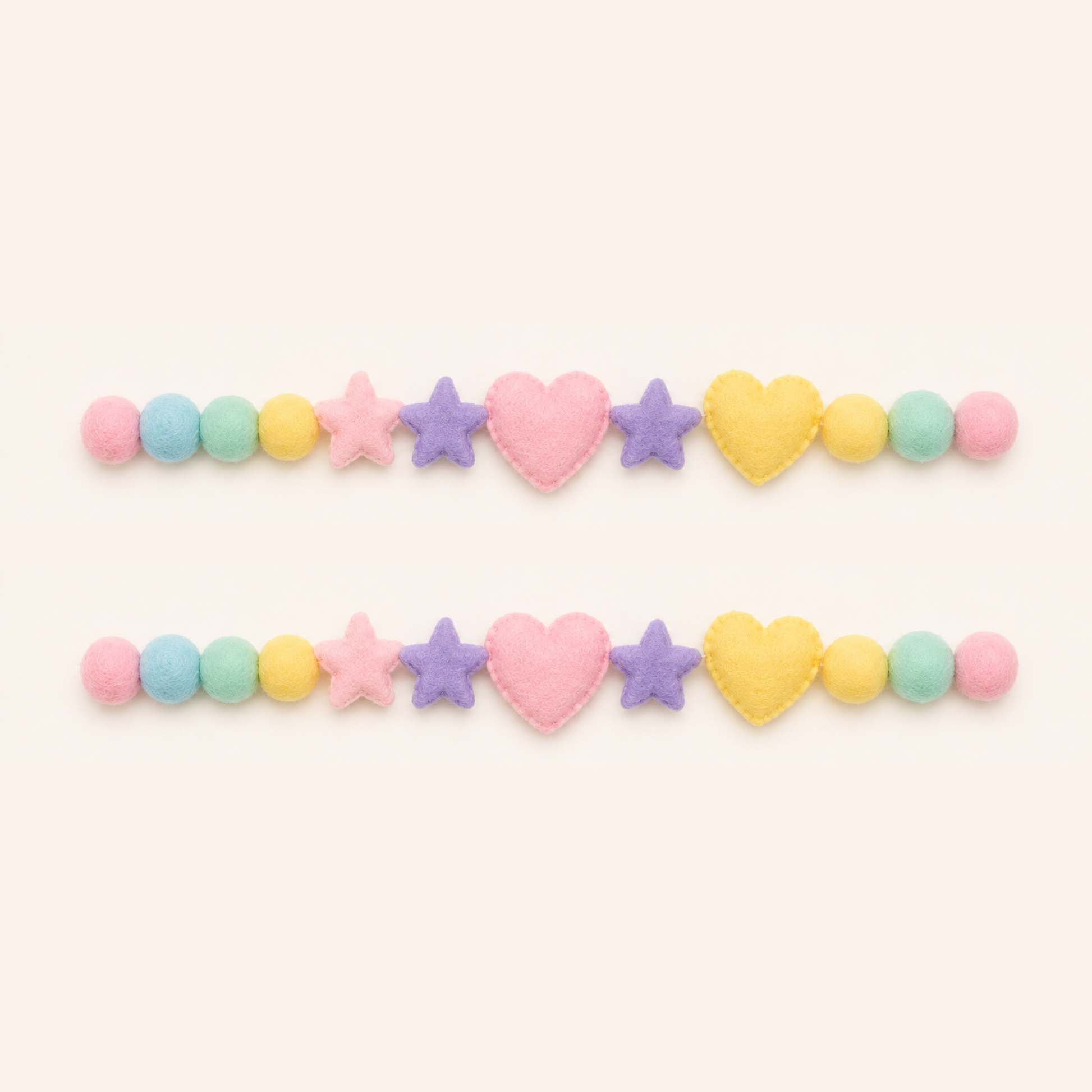 Colorful heart, star, and round beads on a white background