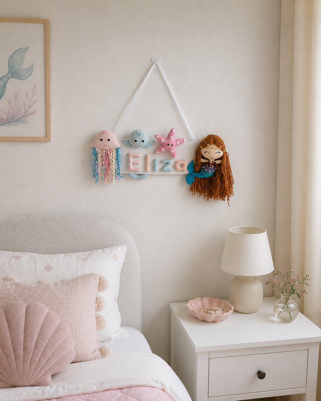 Children's bedroom with a bed, nightstand, and decorative wall hanging.