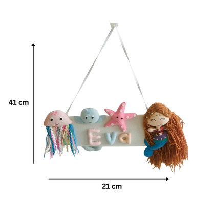 Decorative nameplate with cartoon characters and measurements on a white background