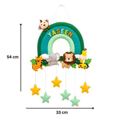 Children's nameplate with rainbow design and animal characters, featuring the name 'Yaseen'.